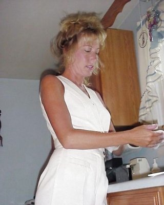 MILF Posing In The Kitchen