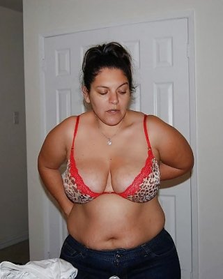 Latina Taking Off Bra