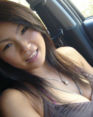 Cute Asian chick flashing her lovely breasts