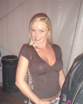 Blonde MILF Silvia Saint Fully Clothed Posing & Flaunting Big Tits At Party