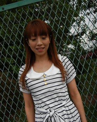 Asian Chihiro Ozawa Is Walking In Her Sexy Striped Dress Outdoors