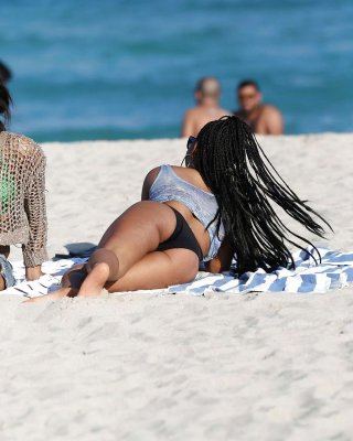 Christina Milian exposing nipples slip in bikini on beach #75229781