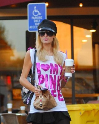 Paris Hilton Showing Her Nice Legs In Mini Skirt