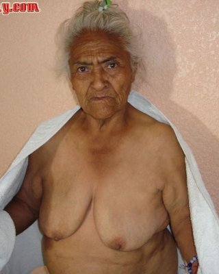 Granny In Chair Shows Her Pussy And Big Tits