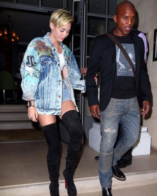 Miley Cyrus Wearing Denim Hotpants  Fuck-me Boots Out In London