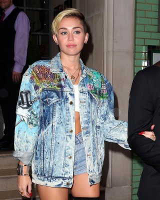 Miley Cyrus Wearing Denim Hotpants  Fuck-me Boots Out In London