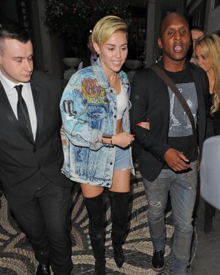 Miley Cyrus Wearing Denim Hotpants  Fuck-me Boots Out In London