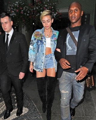 Miley Cyrus Wearing Denim Hotpants  Fuck-me Boots Out In London