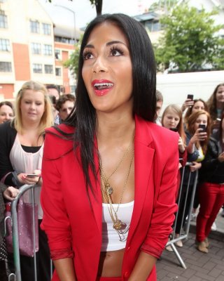 Nicole Scherzinger Braless In A Hot Red Suit And White Belly Top While Arriving 