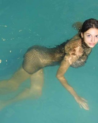 Busty latina in fishnet skirt having fun at the pool #77976386