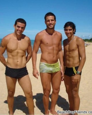 Big Muscled Dudes Are Wearing Tight Trunks At The Beach