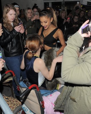 Ariana Grande Wears Skimpy Black Belly Top And Short Skirt At BBC Radio 1 In Lon