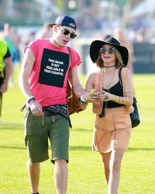 Sarah Hyland cleavy and leggy in black top and leather mini skirt at Coachella V #75167322