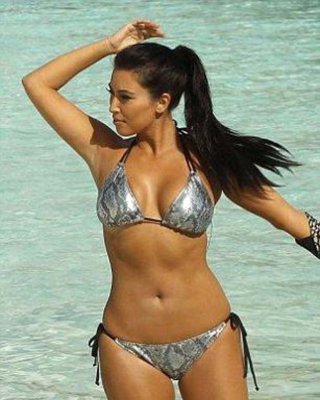 Kim Kardashian Exposing Sexy Body And Huge Boobs In Bikini On Beach