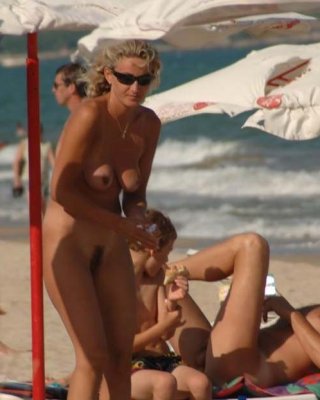 Busty Milf Not Shy About Posing Nude At The Beach