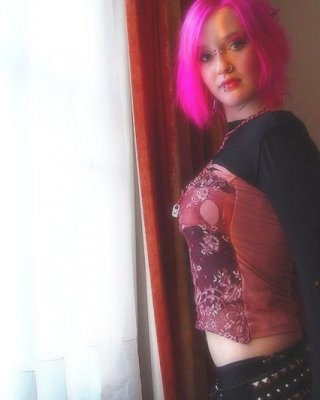 Pink Haired Gothic Fetish Chick Showing Off  Her Pierced Boobs