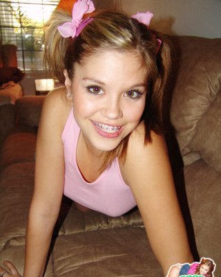 Sweet Teen Topanga Teases In A Pink Top While Laying On The Couc