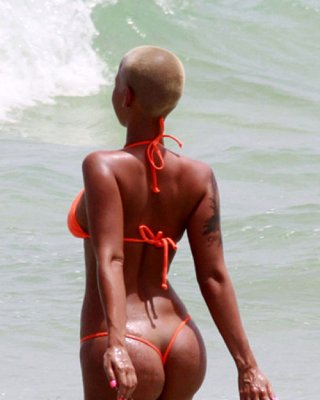 Amber Rose Exposing Her Nice And Big Tits And Great Ass In Thong Paparazzi Pictu