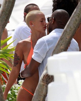 Amber Rose Exposing Her Nice And Big Tits And Great Ass In Thong Paparazzi Pictu