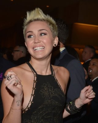 Miley Cyrus Showing Side Boob In A Black Partially See-thru Dress At Clive Davis