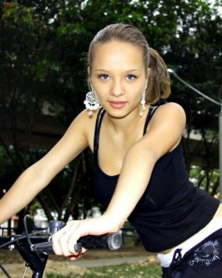 Paris Milan Riding A Bicycle Showing Cleavage