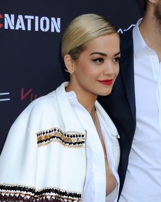 Busty Rita Ora braless wearing pasties under a wide open shirt at the Roc Nation #75206375