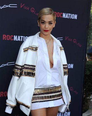 Busty Rita Ora braless wearing pasties under a wide open shirt at the Roc Nation #75206397