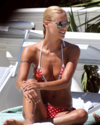 Michelle Hunziker Showing Her Nice Big Tits And Posing In Thong