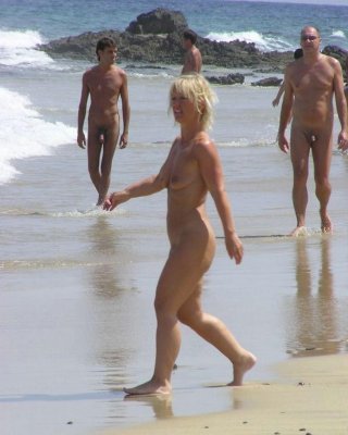 Barely Legal Nudist Babe Lights Up At The Beach