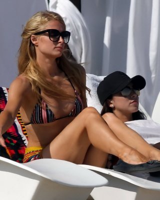 Paris Hilton Shows Off Her Hot Body Wearing Tiny Striped Bikini At The Beach In 