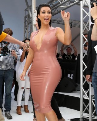 Kim Kardashian Shows Off Her Curvy Body Wearing A Tight Latex Dress At Hype Ener