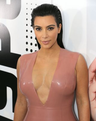 Kim Kardashian Shows Off Her Curvy Body Wearing A Tight Latex Dress At Hype Ener