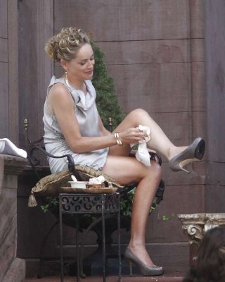 Sharon Stone Showing Her Panties Upskirt While Spread Cream On Her Legs