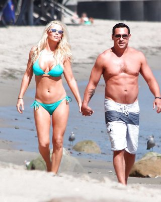 Jenny McCarthy Looking Very Cute And Sexy In Green Bikini On Beach