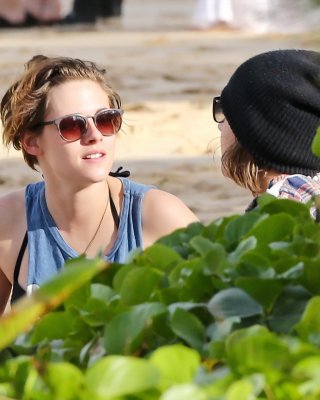 Kristen Stewart in bikini top and shorts kissing with some girl on the beach in  #75176304