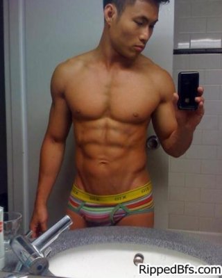 Topless dude with six pack abs is doing a sexy dance #76939268