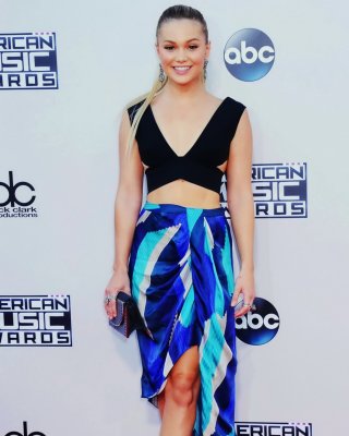 Olivia Holt Cleavy And Leggy In Belly Top And Skirt