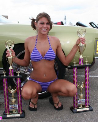 Melissa Midwest Posing On Cars At A Car Show