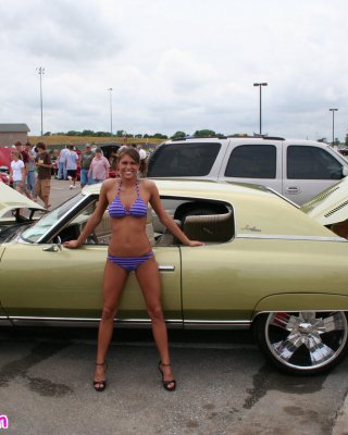 Melissa Midwest Posing On Cars At A Car Show