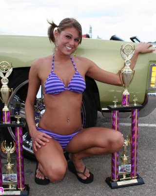 Melissa Midwest Posing On Cars At A Car Show