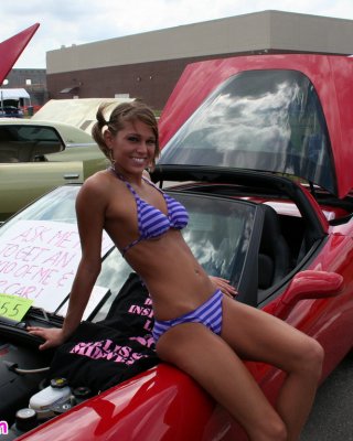 Melissa Midwest Posing On Cars At A Car Show