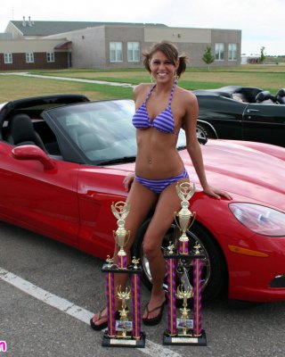 Melissa Midwest Posing On Cars At A Car Show