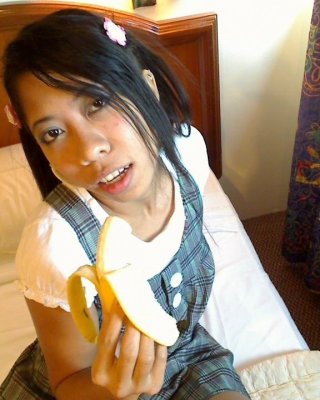 Asian Bali Teen Girl Blows Banana