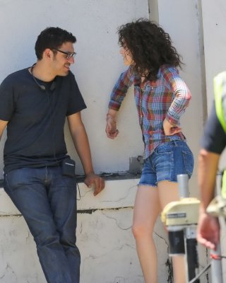Emmy Rossum wearing denim shorts and some crazy hair on the set of Comet in LA #75228394