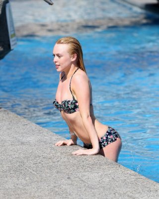 Jorgie Porter showing off her hot body in a skimpy floral bikini at the beach in #75172555
