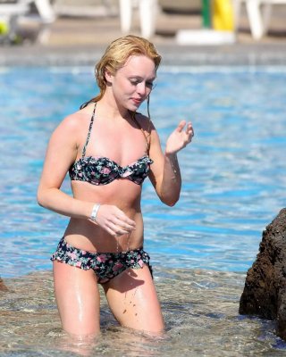 Jorgie Porter showing off her hot body in a skimpy floral bikini at the beach in #75172600
