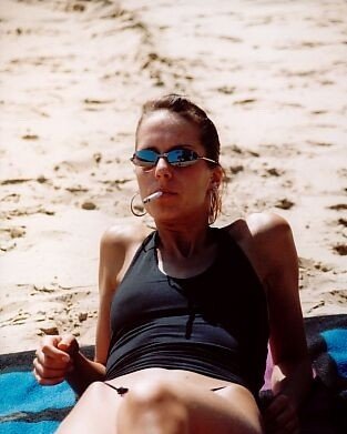 Teen Smoking At The Beach