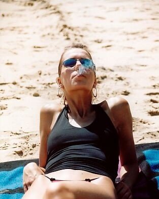 Teen Smoking At The Beach