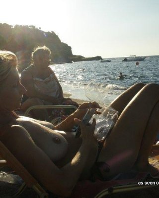 Gallery Of A Busty Wife Sunbathing Topless While On Vacation