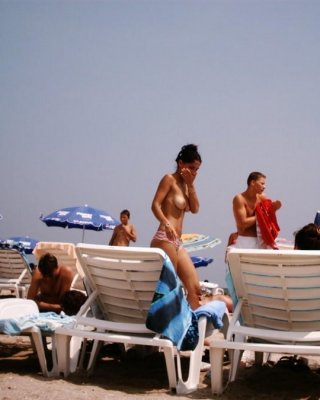 Young Nudist Shows Off Her Slim Body At The Beach